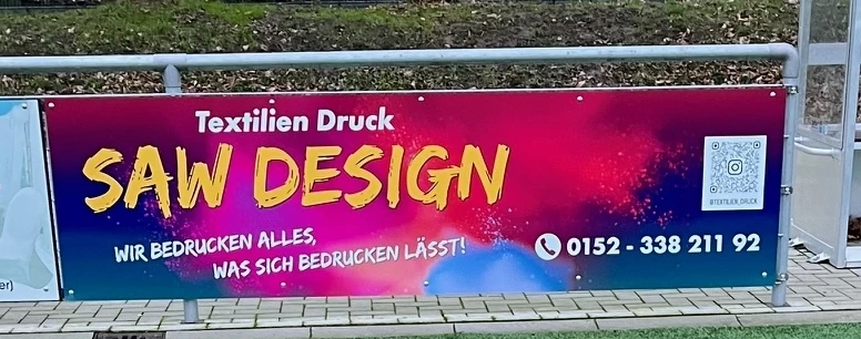 Bandenwerbung von SAW Design am Sportplatz Otto-Nietsch-Weg des TuRa Meldorf 1898 e.V.
